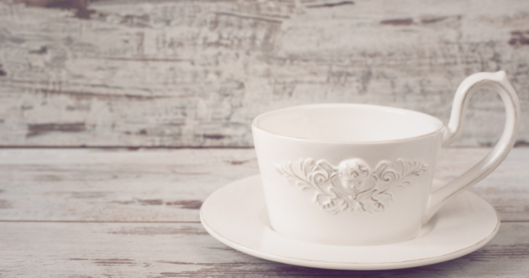 White TeaCup Saucer on Wood