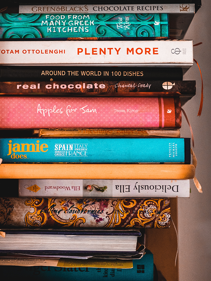 Assorted cookbooks that could be used to make a family recipe binder.
