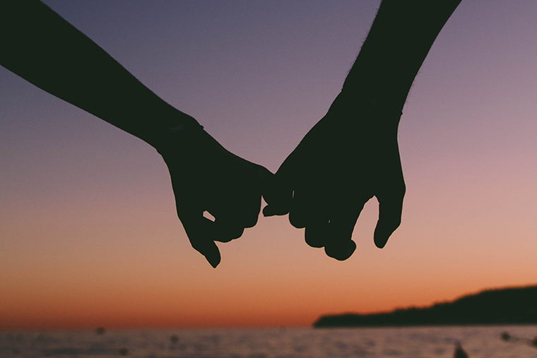 Holding hands - stronger relationships can be a result of a positive state of mind