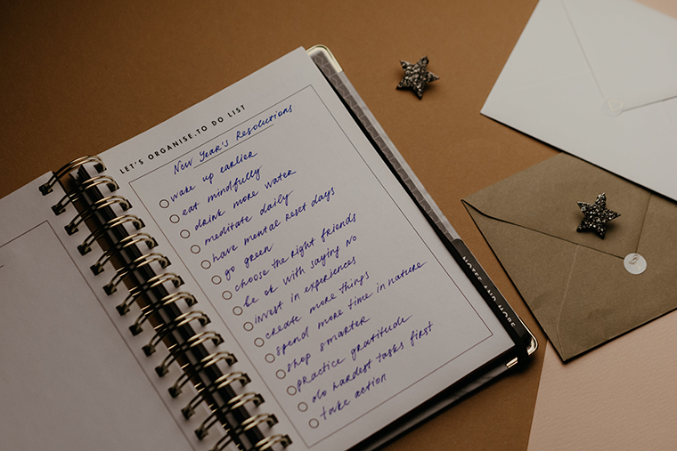 Writing your resolutions in a journal helps you track them throughout the year